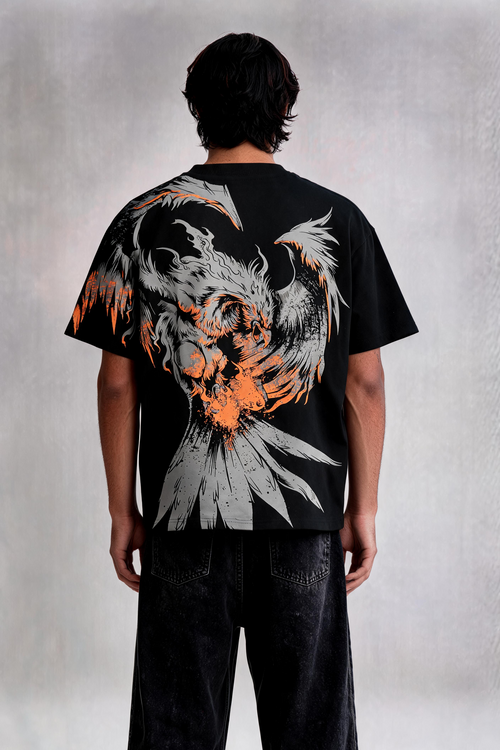 Person wearing a black t-shirt with a large eagle design on the back against a plain background