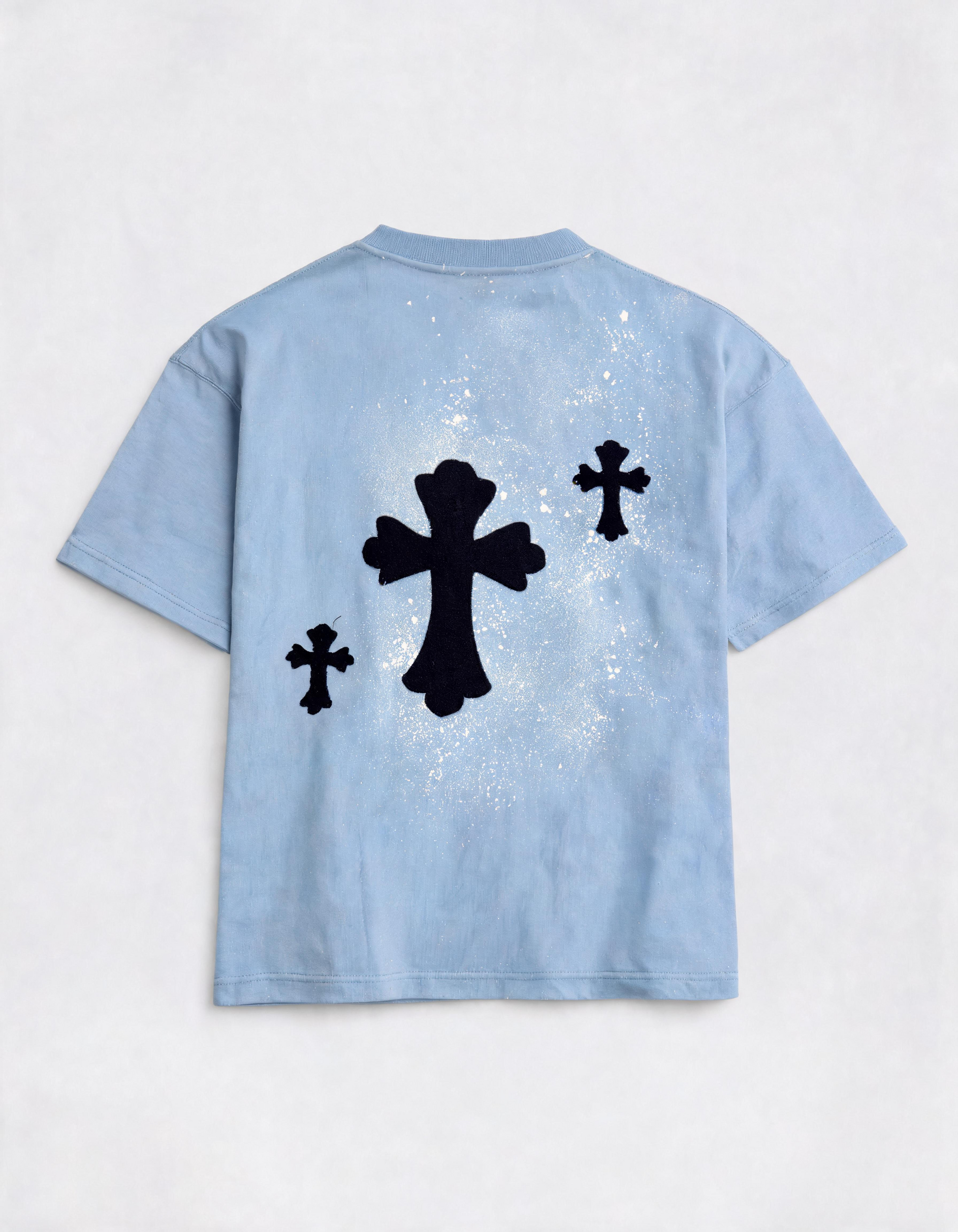 Light blue t-shirt with black cross designs on a white background