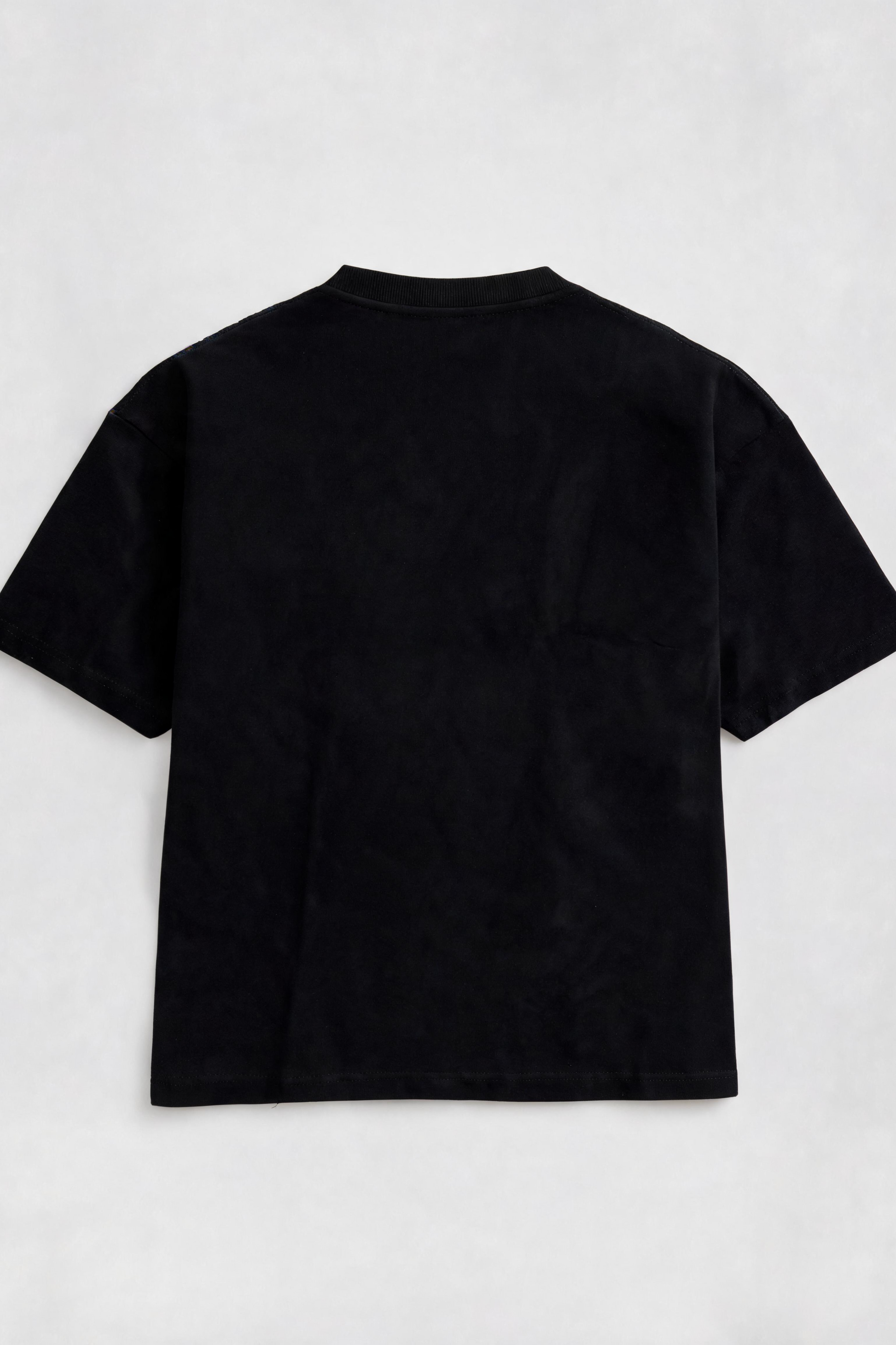 Black t-shirt on a light gray background