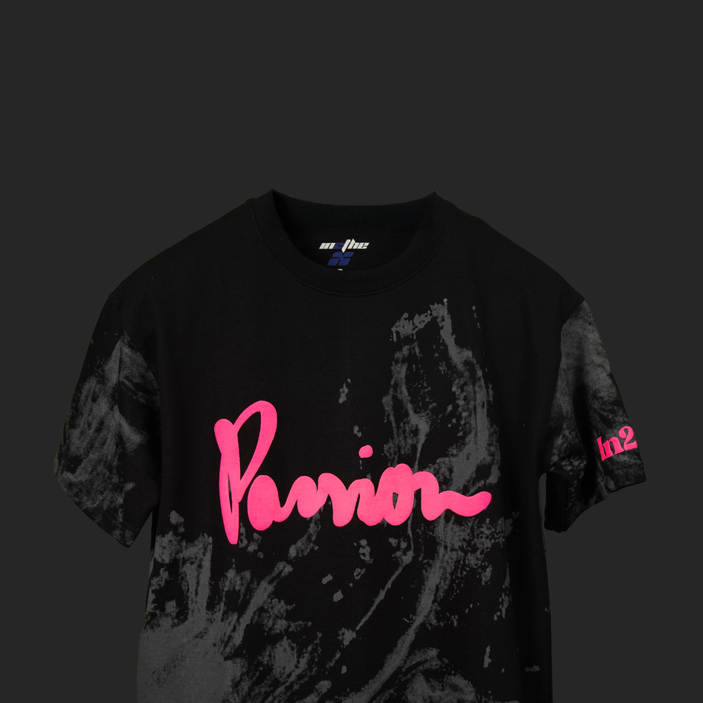 Black t-shirt with pink text and design on a dark background