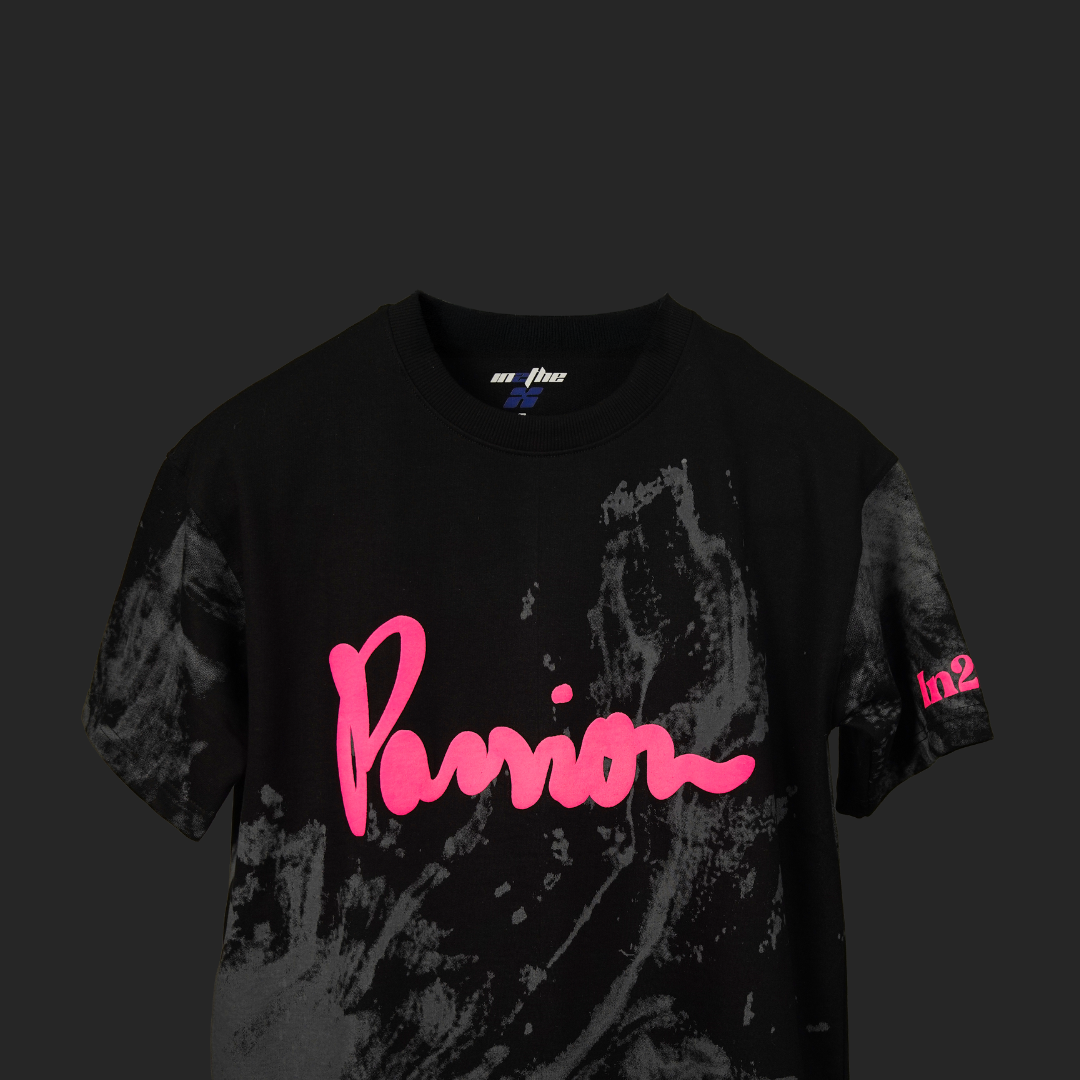 Black t-shirt with pink text and design on a dark background