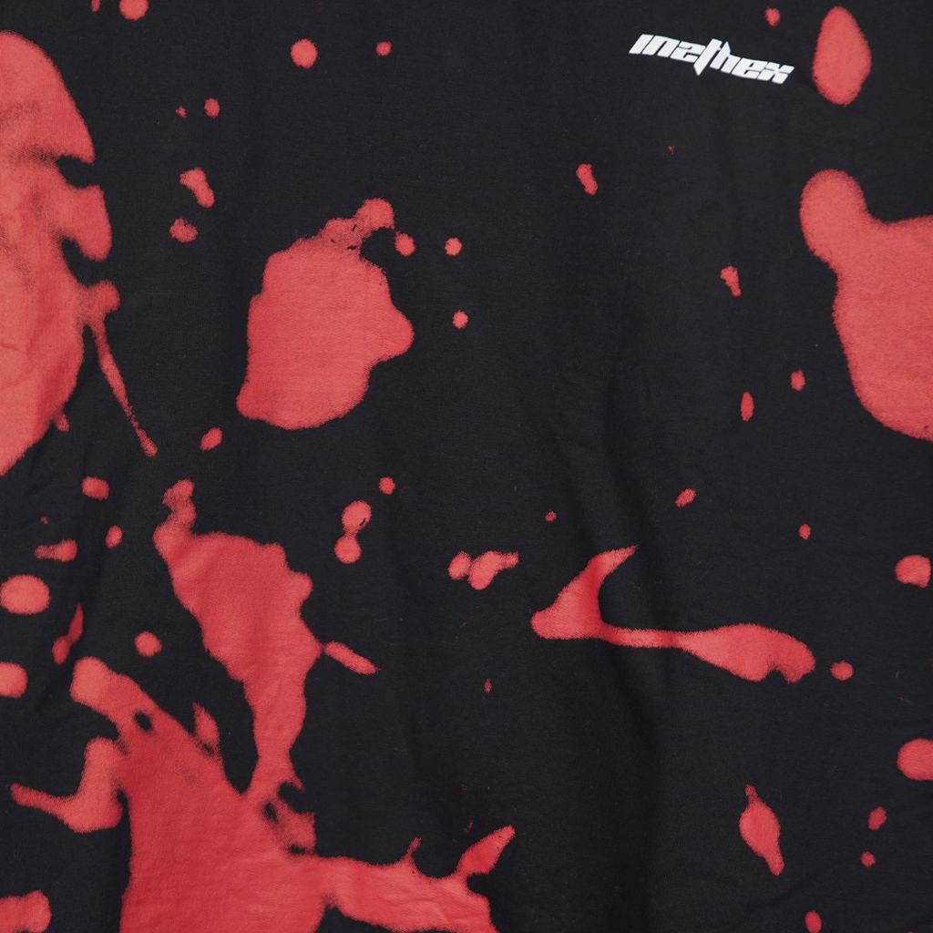 Black shirt with red abstract patterns and 'Mathew' branding.